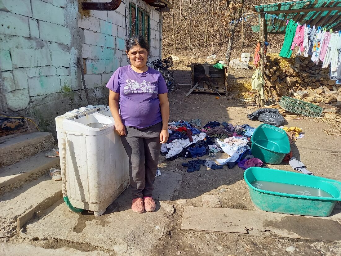 Sorin's mother in the backyard where she does the laundry