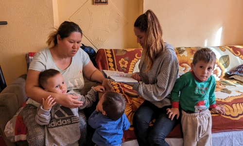 Cristina reads with her family