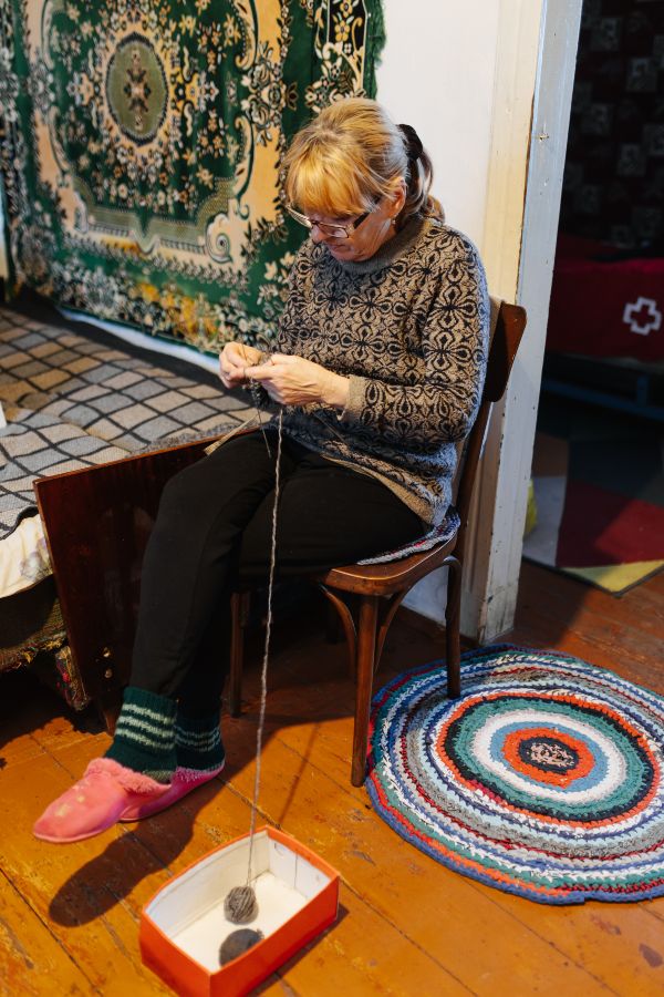 Olena Knitting at home